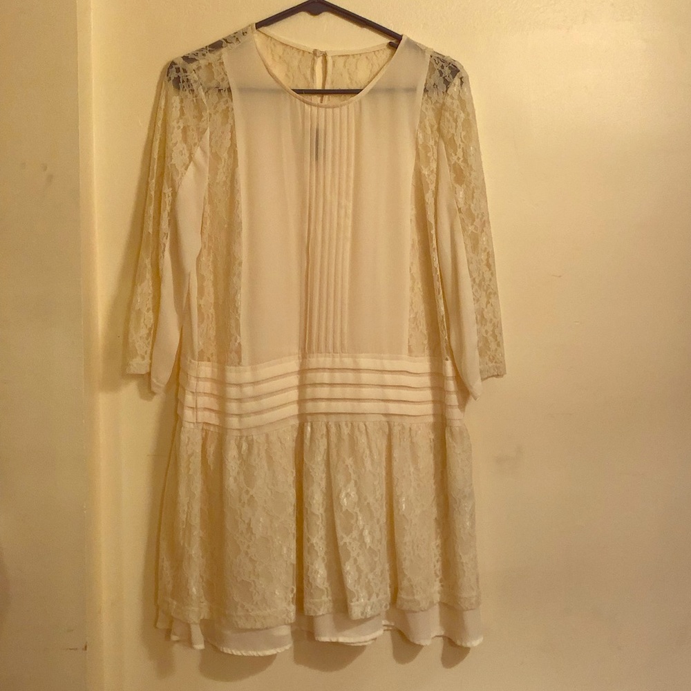 Sheer, cream lace dress.